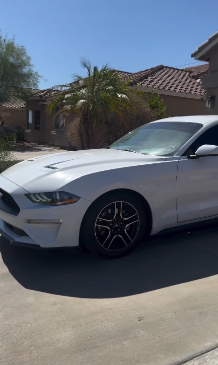 White Ford Mustang with window tint